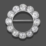 A Diamond Brooch, twelve old cut diamonds in a circular arrangement, in white millegrain settings,