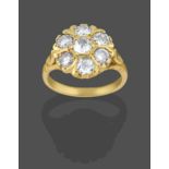 An 18 Carat Gold Diamond Cluster Ring, the old cut and eight-cut diamonds in yellow claw settings,