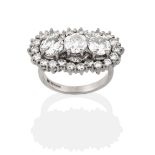 An 18 Carat White Gold Diamond Triple Cluster Ring, three round brilliant cut diamonds within a