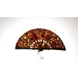 A Tortoiseshell Brisé Fan, circa 1920's, the two guards and twenty-one inner sticks pierced in a