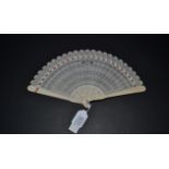 A Very Elegant Early 19th Century Chinese Carved Ivory Brisé Fan, Qing Dynasty, with twenty-three