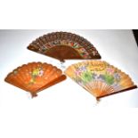 A 19th Century Wood Brisé Fan, with colourful applied printed panels showing the costumes of the