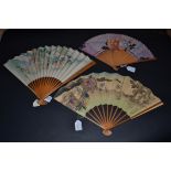 A Miscellaneous Selection of 20th Century Fans, comprising a paper fan mounted on bamboo sticks