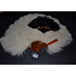 A Large Frothy White Ostrich Feather Fan, mounted on blonde tortoiseshell or resin, the upper