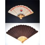 An Unusual Paper Fan, initially appearing quite plain, in dark aubergine, but in fact featuring a