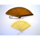 Nelly: A Large Late 19th Century Wood Brisé Fan, the rounded guards both stained a deeper shade, and
