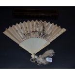 A Good Carved Ivory Chinese Fan with finely embroidered cream silk leaf, the gorge sticks plain,