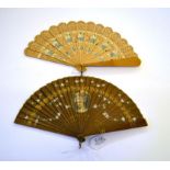 A Late 19th Century Dark Wood Brisé Fan, the guards varnished, painted centrally with the profile of
