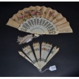 An Early 19th Century Ivory Brisé Fan, the gothic stick tips painted gold, beneath which are painted