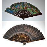 A Large Asymmetrical Chinese Lacquer Fan, the monture of wood well painted in black lacquer with