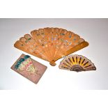 A Late 19th Century Wood Brisé Scrap Fan, the sixteen inner sticks applied recto/verso with paper