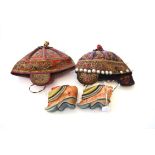 Two Embroidered Chinese Hats for Children, worked in panels both vertically and horizontally, with a
