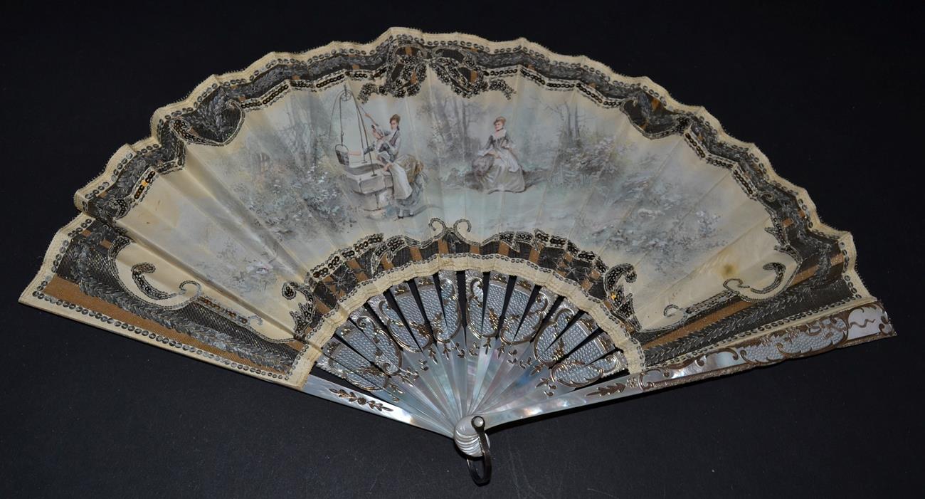 An Early 20th Century White Mother-of-Pearl Fan, the leaf with cream background net, overlaid with