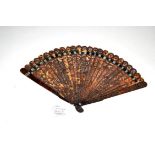 A Fine and Slender 19th Century Chinese Carved Tortoiseshell Brisé Fan, the intricate design