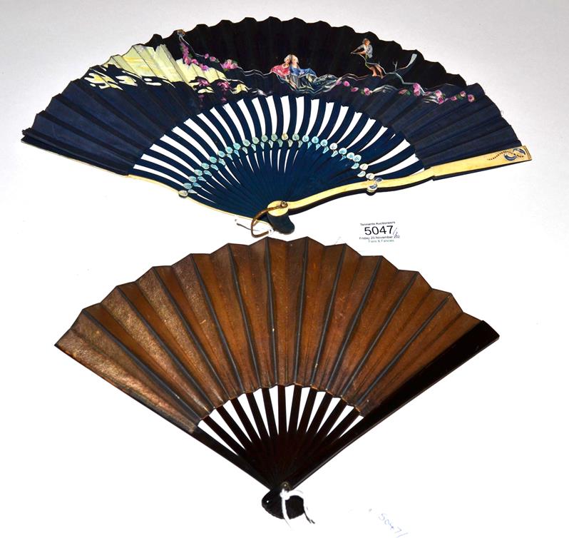 A Striking Fan, the wood sticks painted black, serpentine, the guards of shaped bone. The fan,