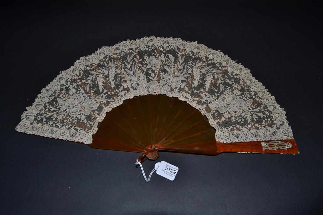 A Late 19th Century Brussels Lace Fan, the Point de Gaze needle lace leaf mounted on resin or ''