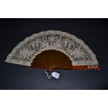 A Late 19th Century Brussels Lace Fan, the Point de Gaze needle lace leaf mounted on resin or ''