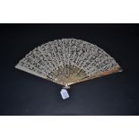 A Large Circa 1900 Pink Mother-of-Pearl Fan, the monture lightly carved and slightly pierced, gilded