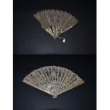 A Pretty, Turn of the Century Fan, with an unusually shaded mother-of-pearl monture, quite