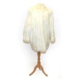 A Saga White Fox Fur and Leather Coat, the panels of fur alternated with lengths of white leather