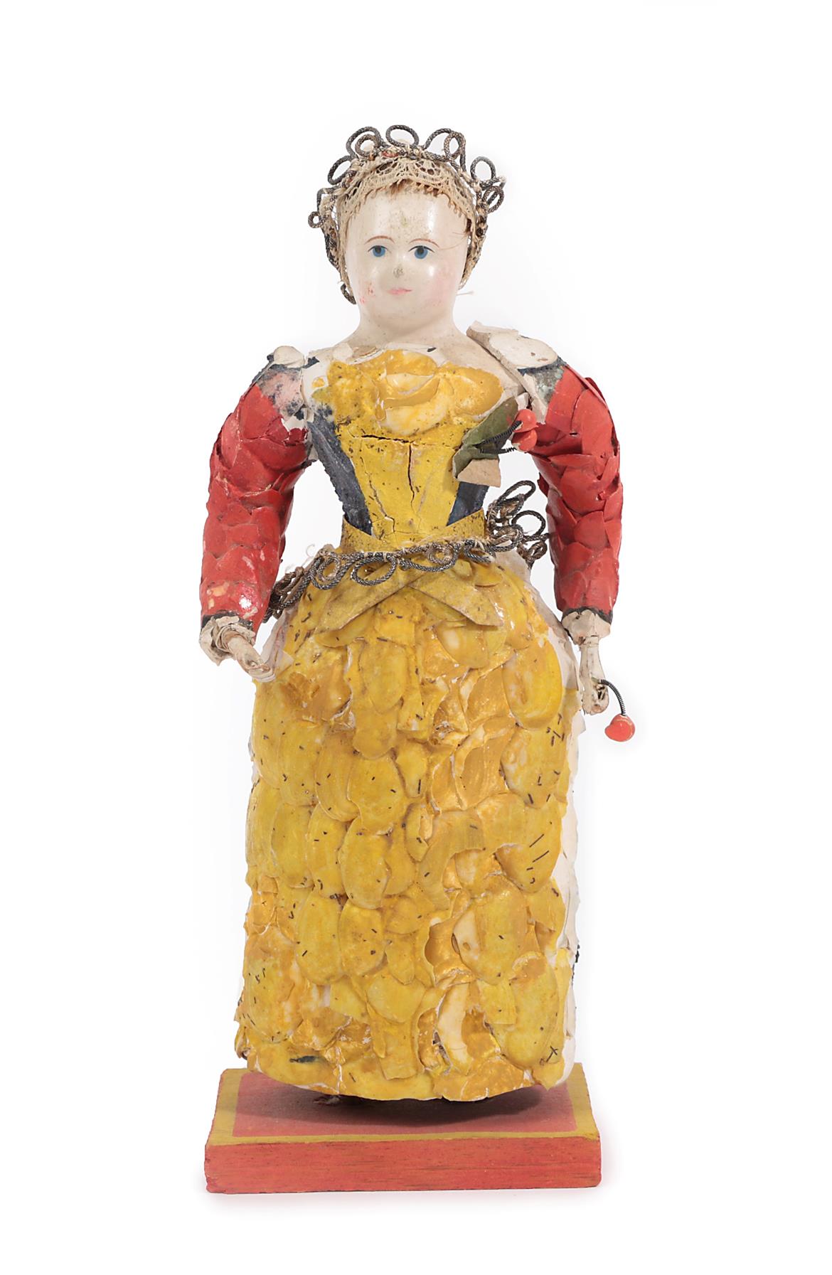 Another Similar Late 19th Century Carved Polychrome Doll, with jointed bent arms, blue painted eyes,