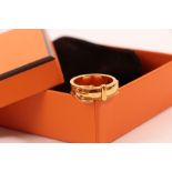 A Hermes Gilt Metal Buckle Scarf Ring, the yellow plain polished band with a buckle motif to the