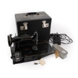 A Circa 1950s 221K Black Singer Sewing Machine in a fitted case