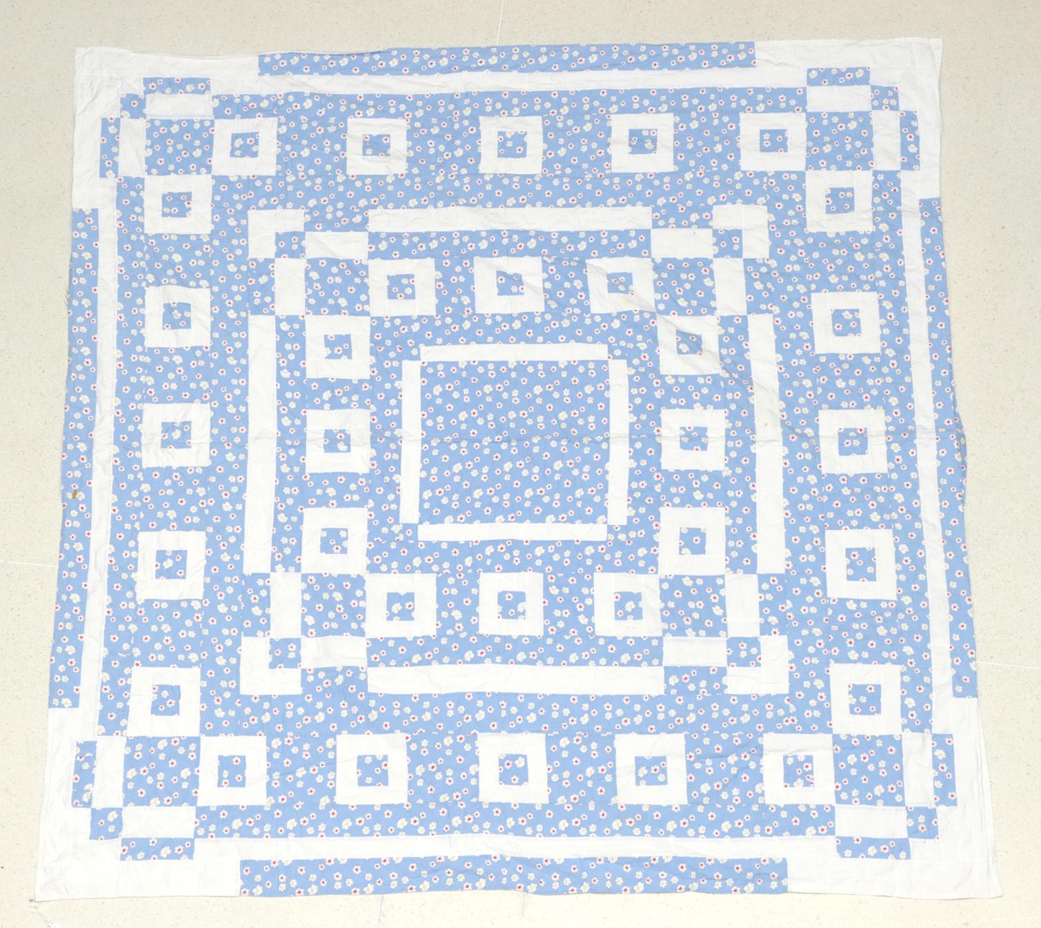 Early 20th Century Blue Floral Quilted Bed Cover, designed with white cotton squares and quilted