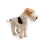 A Circa 1950s Steiff Model of a Standing Fox Terrier, with glass eyes, stitched nose, stud to ear,