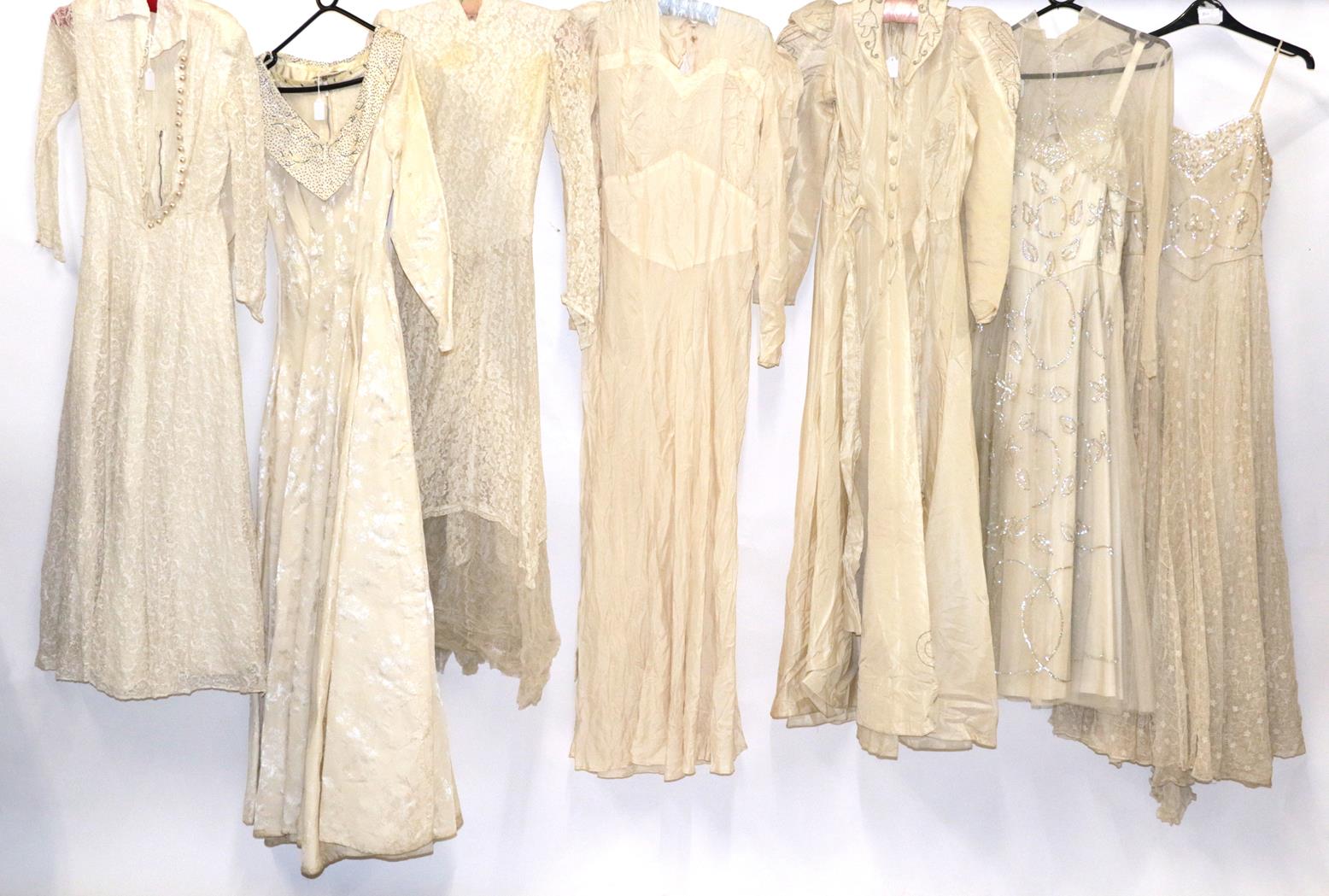 Early 20th Century Wedding Dresses, comprising a Gordon Gowns white lace mounted long sleeved