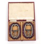 A Pair of 19th Century Shoe Buckles, set with clear and amethyst coloured pastes on a metal frame,