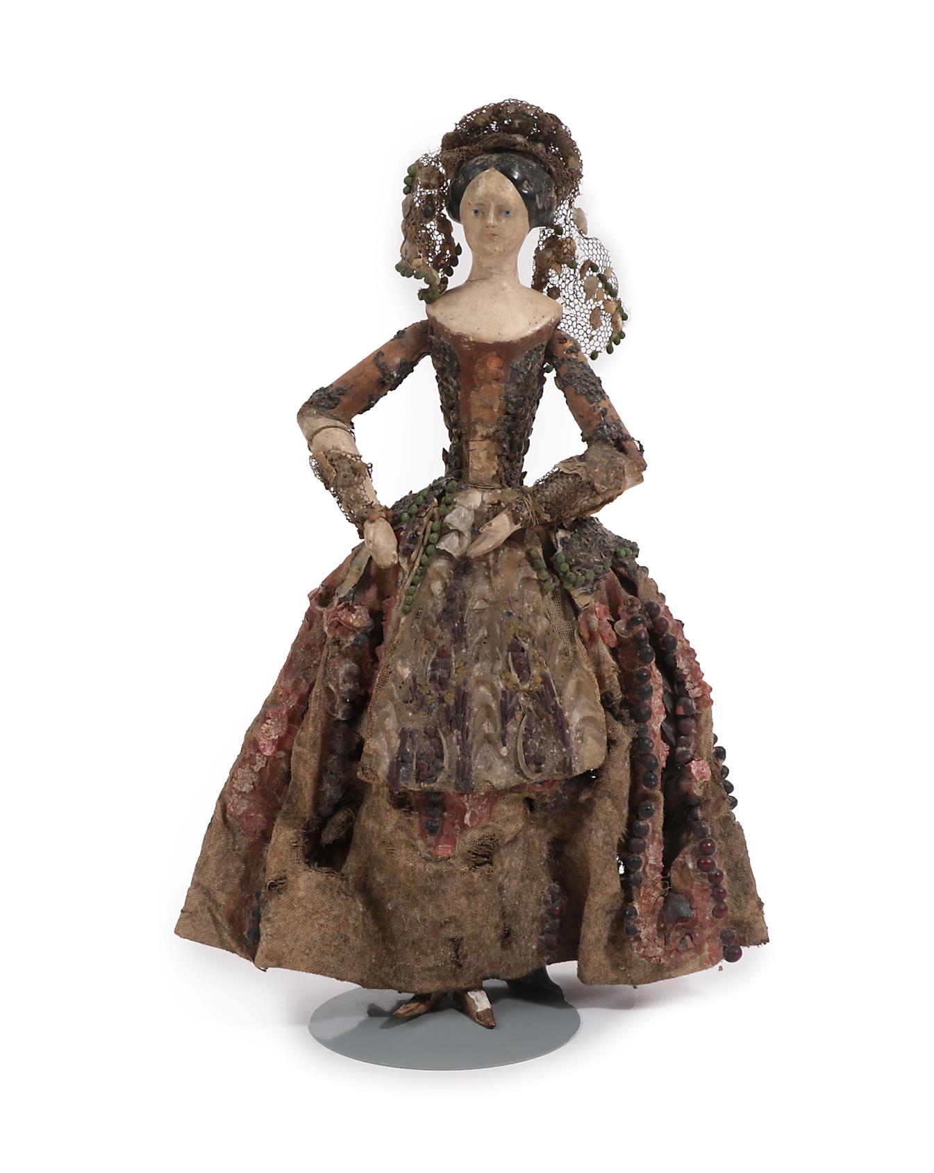 19th Century Carved Polychrome Doll, with jointed bent arms, wooden torso and lower legs, black