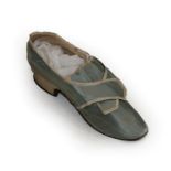 A Mid 18th Century Pale Blue Silk Single Shoe, with natural linen lining, cream silk trim and