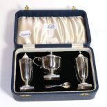 A cased four-piece George V silver condiment-set, by Viners, Sheffield, 1934, comprising a mustard-