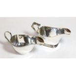 Two George V silver sauceboats, the first by Thomas Fattorini, Birmingham, 1934, oblong and on
