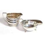A George III silver cream jug, marks worn, circa 1800, helmet shaped and with angular handle, the