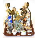 A collection of assorted 20th century porcelain figural lamps, bird figurines, floral baskets,