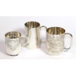 Three silver mugs, the first by Ackroyd Rhodes, London, 1903, cylindrical, engraved with foliage and