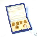 A cased set of 9 carat gold cufflinks and two dress studs stamped '9CT' . Gross weight 7.4 grams.