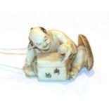 Japanese ivory netsuke, man with glove puppet, 3cm high . Weight 28g