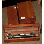 Three cased theodolites