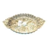 A Victorian silver dressing table-tray, London, 1899, fluted oval, the sides chased with foliage and