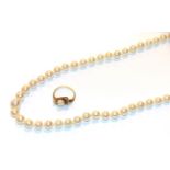 A single row cultured pearl necklace, length 50cm and a cultured pearl ring, indistinctly marked,
