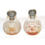 Two silver-mounted cut-glass scent-bottles, each globular and cut with hobnails, the covers