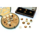 A selection of studs, including a cased set of four gilt metal studs, a pair of mother-of-pearl