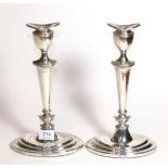 A pair of Elizabeth II silver candlesticks, by A Taite and Sons Ltd., London, 1966, each on