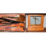 A full sized violin, bears label to interior and two bows, cased and an early 20th century