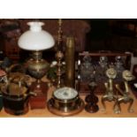 A brass oil lamp, two brass watering cans, a 19th century tea-caddy, a brass wall barometer, a
