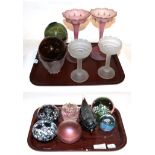 A collection of 19th/ 20th century coloured glass wares including witches' balls, paperweights, etc