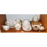 Twelve Coalport coffee cans and saucers, together with seven Minton's twin-handled cups and saucers,